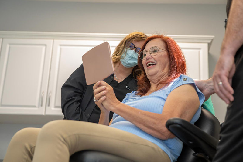 Patient smiling confidently after their dental procedure